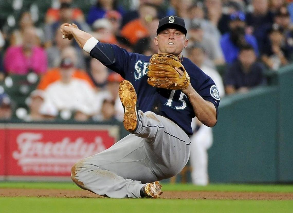 Seattle Mariners third baseman Kyle Seager (15) attempts to throw out Houston Astros' Jose Altuve during the third inning of a baseball game, Wednesday, July 19, 2017, in Houston. Altuve was safe at first on the play. (AP Photo/Eric Christian Smith)