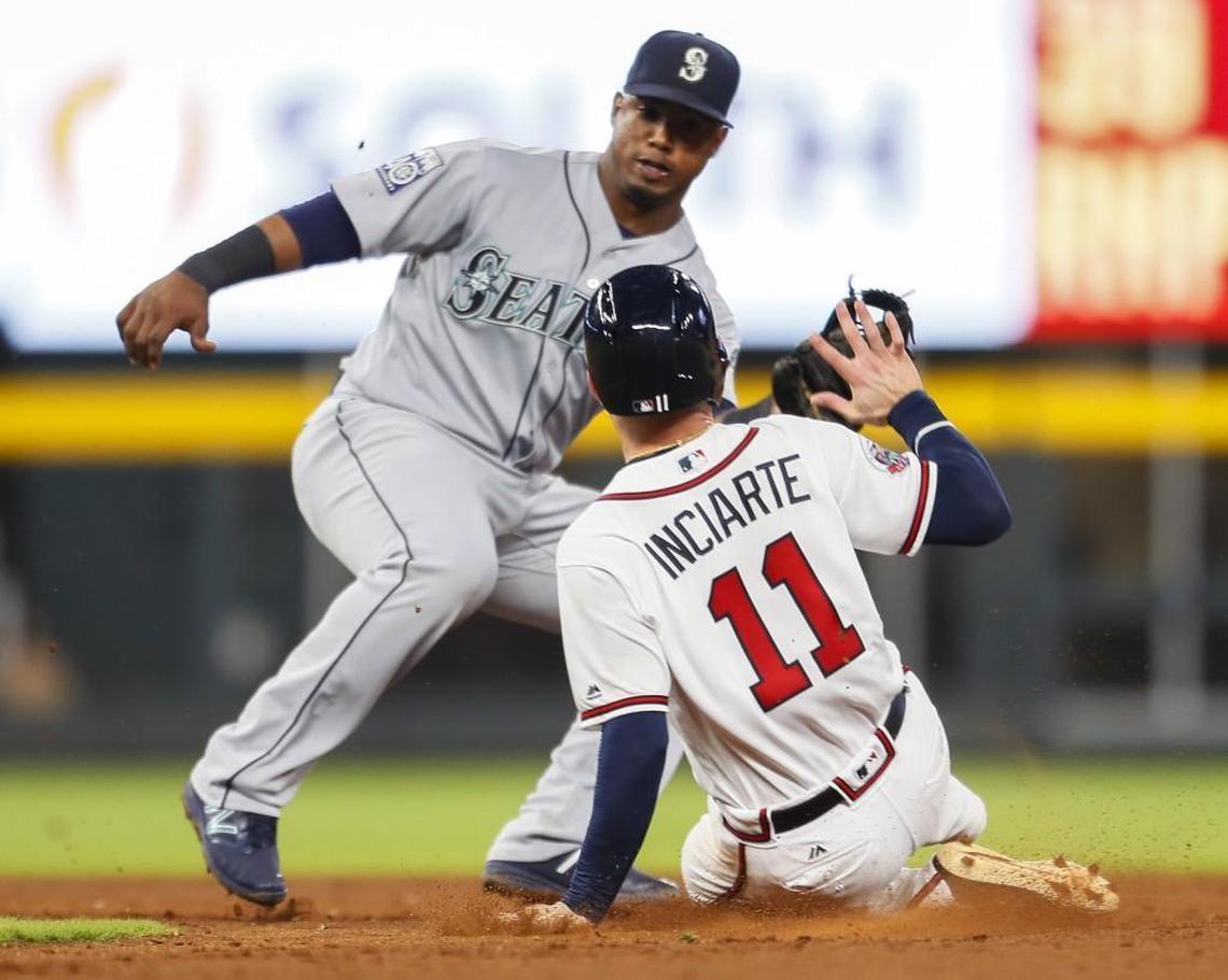 Atlanta Braves Ender Inciarte (11) is caught stealing second by Seattle Mariners shortstop Jean Segura (2) in the ninth inning of a baseball game, Monday, Aug. 21, 2017, in Atlanta. (AP Photo/Todd Kirkland)