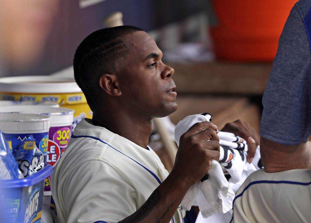Mariners fill-in starting pitcher Roenis Elias looks out from the bench moments after allowing the Dodgers to score five runs on five hits and two walks off him in the top of the first inning Sunday at Safeco Field.