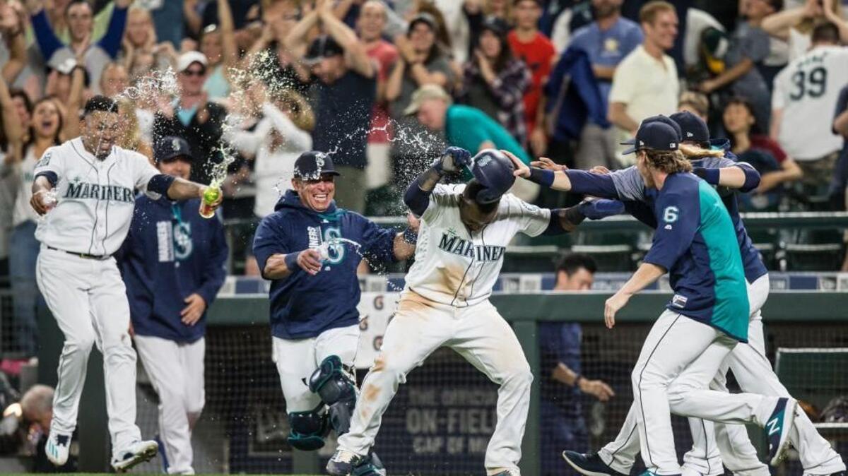 Jean Segura was in the middle of a drenching from teammates Saturday after scoring the winning run on a walk-off wild pitch.