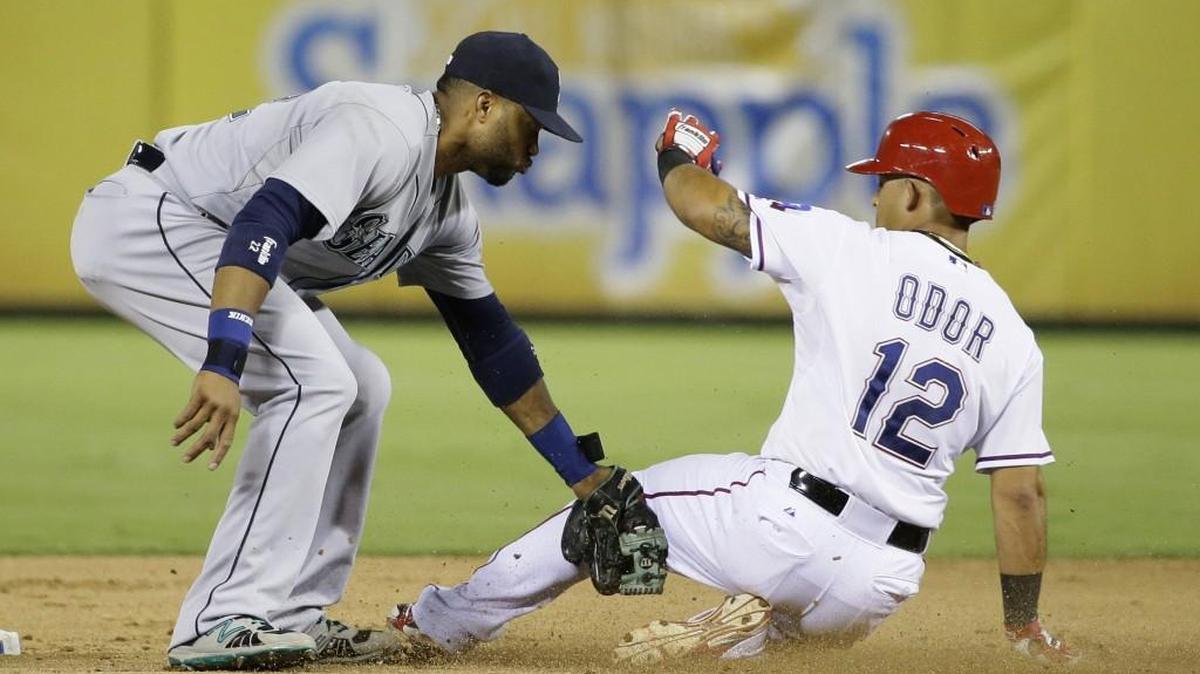 Mariners second baseman Robinson Cano tags out the Rangers’ Rougned Odor (12) during a game this past August. Cano played the final two months of the 2015 season with a sports hernia, which was corrected during the offseason.