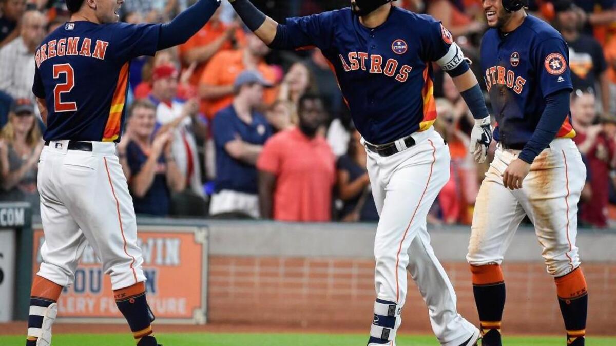 A familiar sight on Sunday: Houston celebrating a home run. In this case, it’s Marwin Gonzalez (middle), who hit a two-run shot in the fifth inning against Mariners reliever James Pazos.