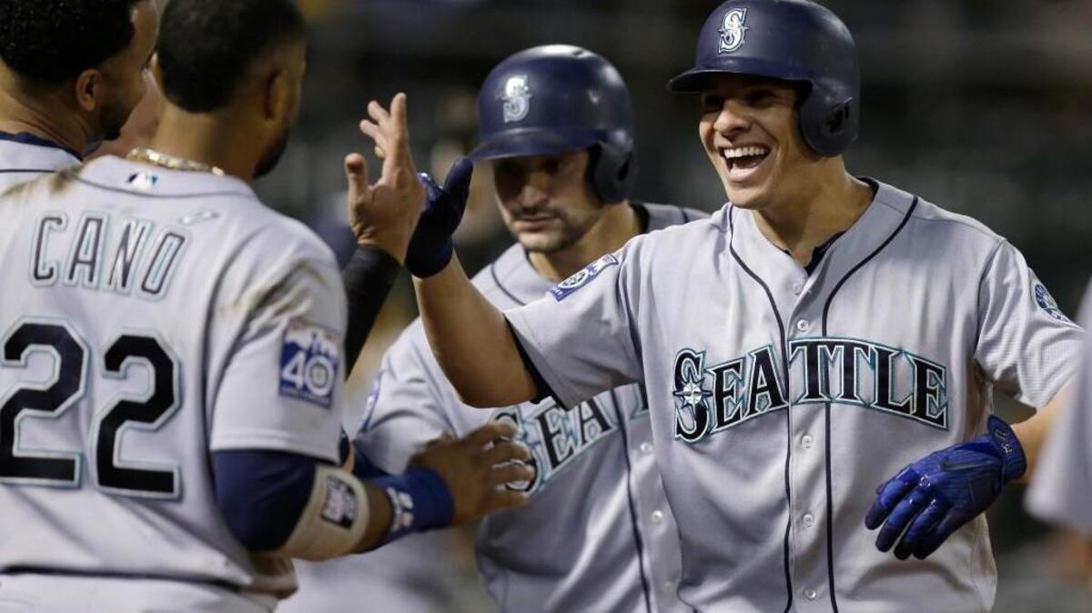 Danny Valencia was all smiles after hittinga three-run homer in the seventh inning.