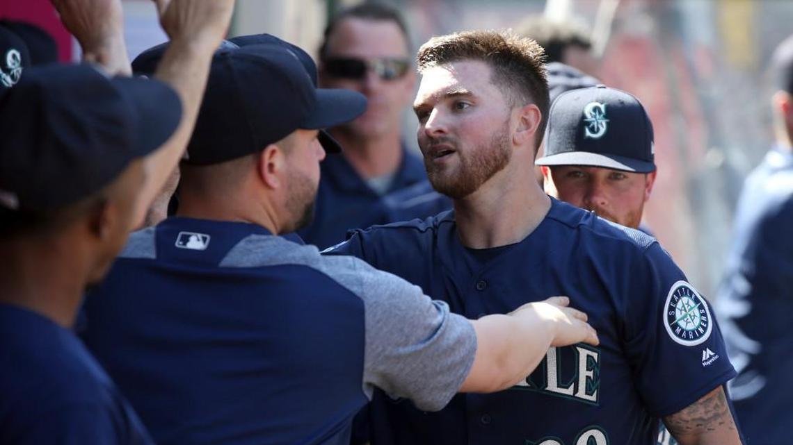 Seattle Mariners Mike Marjama is congratulated after his home run against the Los Angeles Angels in the eighth inning of a baseball game in Anaheim, Calif., Sunday, Oct. 1, 2017. The Angels won, 6-2.