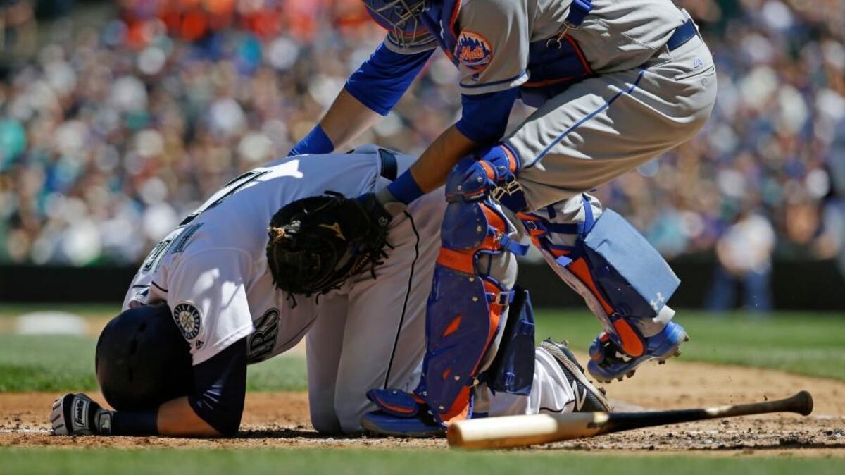 Mets catcher Travis d'Arnaud rushed to aid Mitch Haniger, who hit in the face by a pitch from Jacob deGrom.