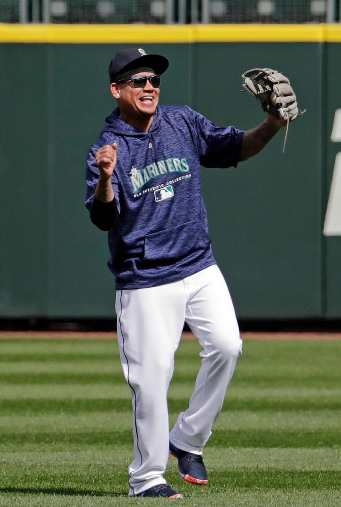 Seattle Mariners pitcher Felix Hernandez smiles as he stands during a practice Wednesday on the team's home field in Seattle.