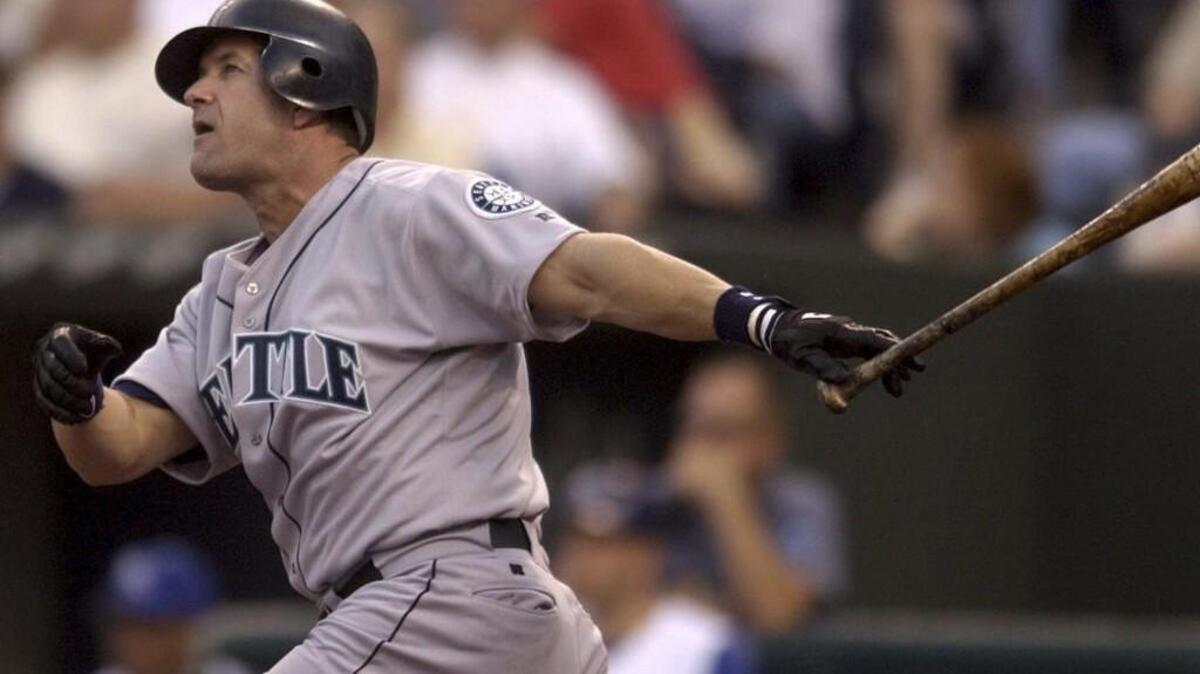 Seattle Mariners' Edgar Martinez hits a three-run home run against the Kansas City Royals in the third inning of a baseball gamein 2003.