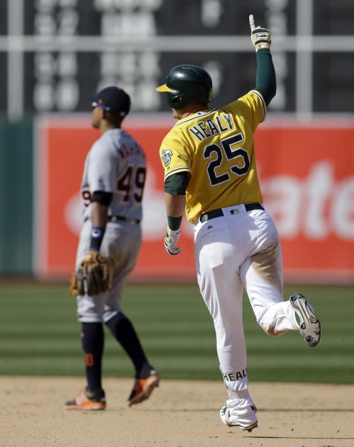 Oakland Athletics' Ryon Healy (25) celebrates as he circles the bases after hitting a walkoff two-run home run off Detroit Tigers' Francisco Rodriguez in the ninth inning of a baseball game Sunday, May 7, 2017, in Oakland, Calif. (AP Photo/Ben Margot)
