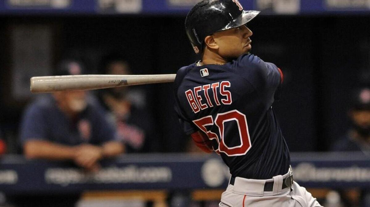 Boston Red Sox’s Mookie Betts hits an RBI-double off Tampa Bay Rays starter Jake Odorizzi during the third inning of a baseball game Friday, July 7, 2017, in St. Petersburg, Fla.