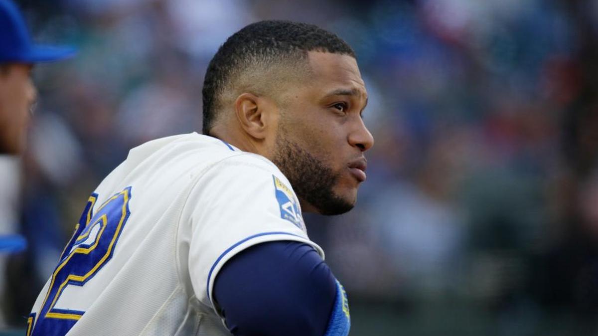 Seattle Mariners’ Robinson Cano watches from the dugout Sunday against the Cleveland Indians in Seattle. The game was the final home game of the season for the Mariners.