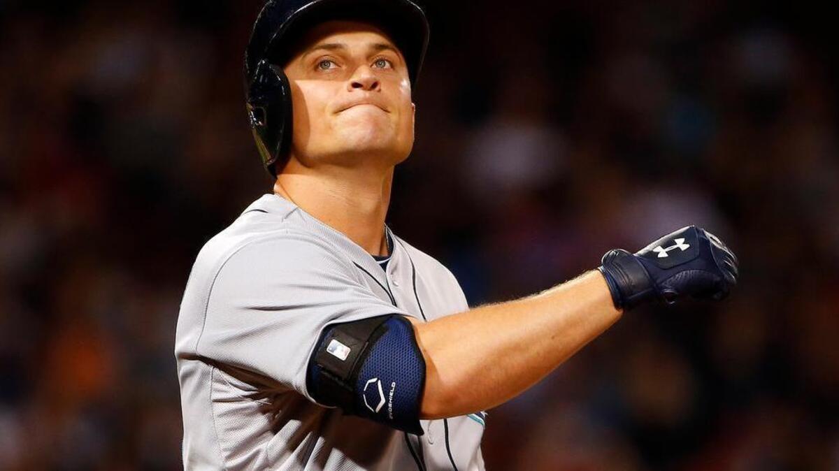 
Seattle Mariners' Kyle Seager reacts after flying out against the Boston Red Sox during the third inning of a baseball game at Fenway Park in Boston Friday, Aug. 14, 2015.
