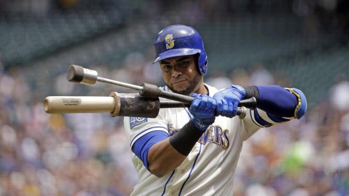 Nelson Cruz, shown warming up on Sunday at Safeco Field, has hit 103 homers in two-and-a-half seasons with the Mariners.