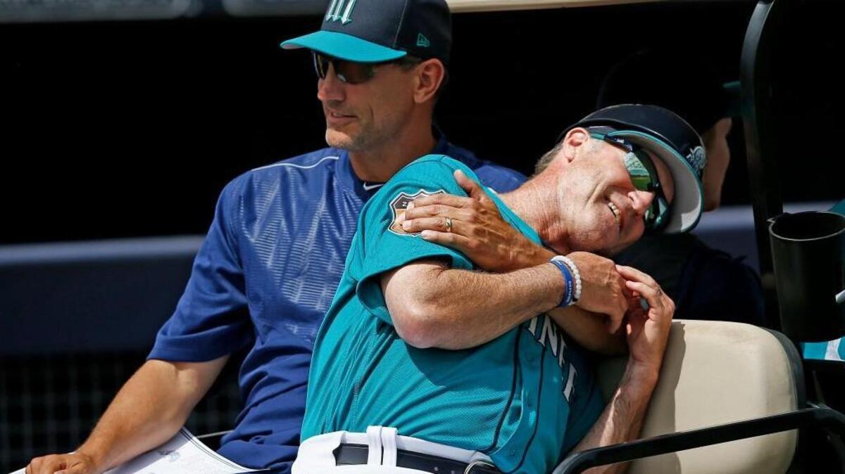 Tim Bogar (left) and Casey Candaele won’t return next year to the Mariners’ coaching staff.