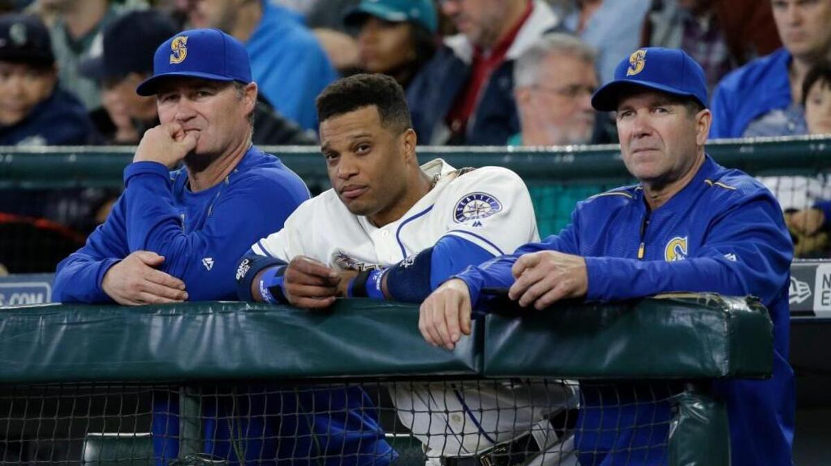 Seattle manager Scott Servais, from left, infielder Robinson Cano and hitting coach Edgar Martinez look on Sunday against Minnesota. The Twins won 5-4, taking all three games of the series.