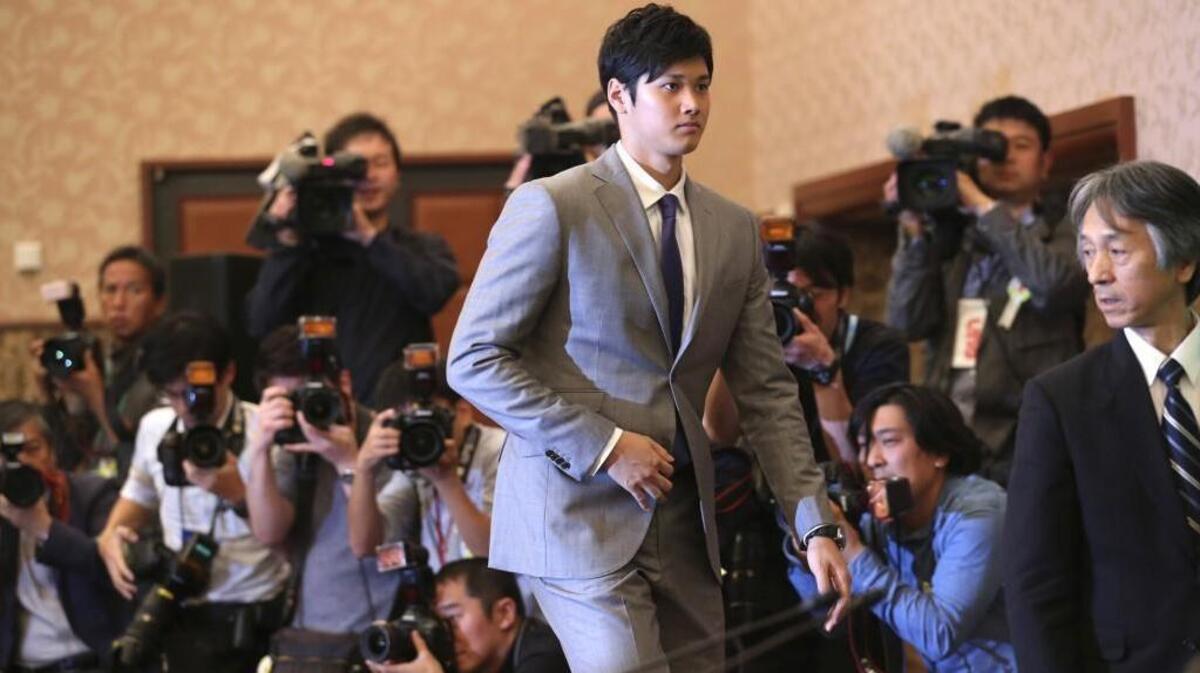 Japanese pitcher-outfielder Shohei Ohtani arrives for a press conference at Japanese National Press Center in Tokyo in November. Ohtani is reportedly meeting with teams this week in Los Angeles.