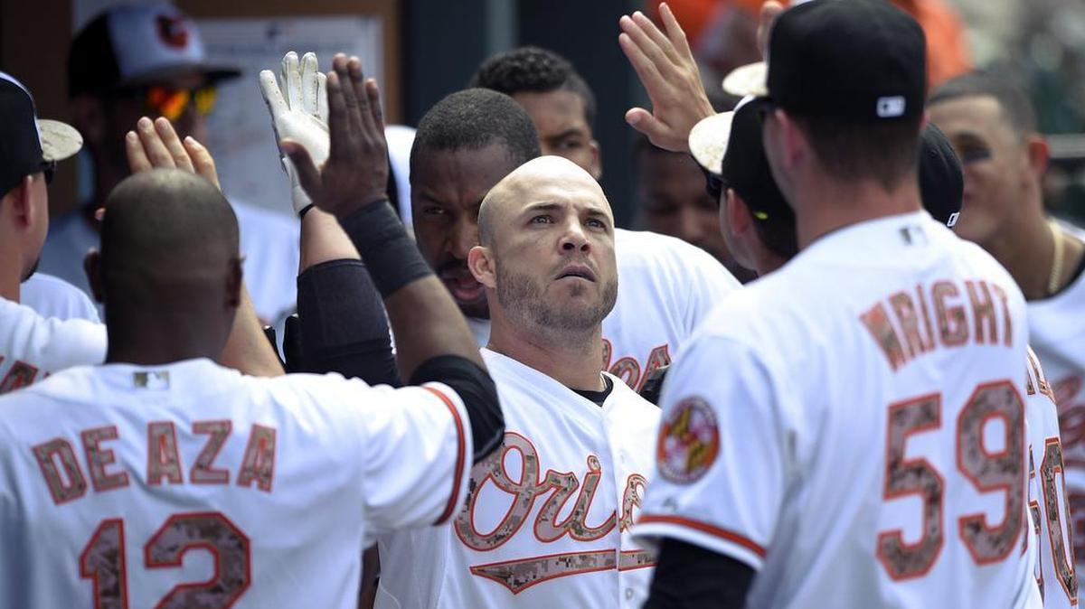 Baltimore’s Steve Pearce, center, is a pending free agent with the Orioles, and would fit the profile of what the Mariners are looking for to possibly replace Adam Lind at first base.