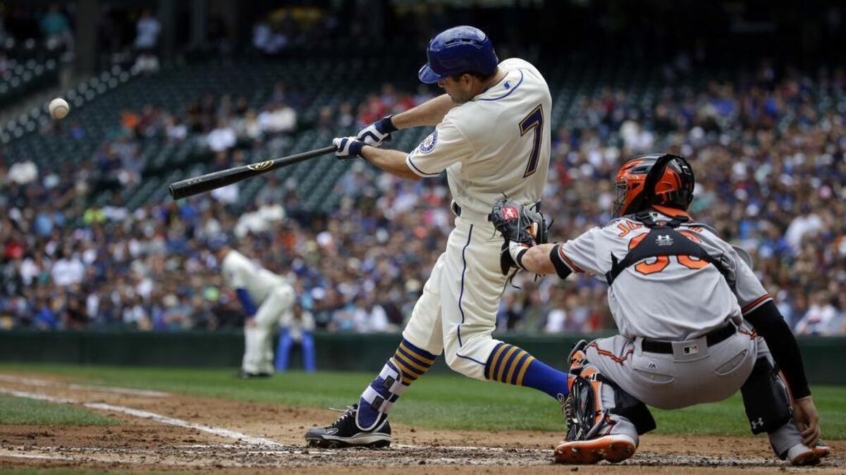 Seattle outfielder Seth Smith hits a grand slam in the third inning to give the Mariners a 4-0 lead over the Baltimore Orioles at Safeco Field on Sunday.