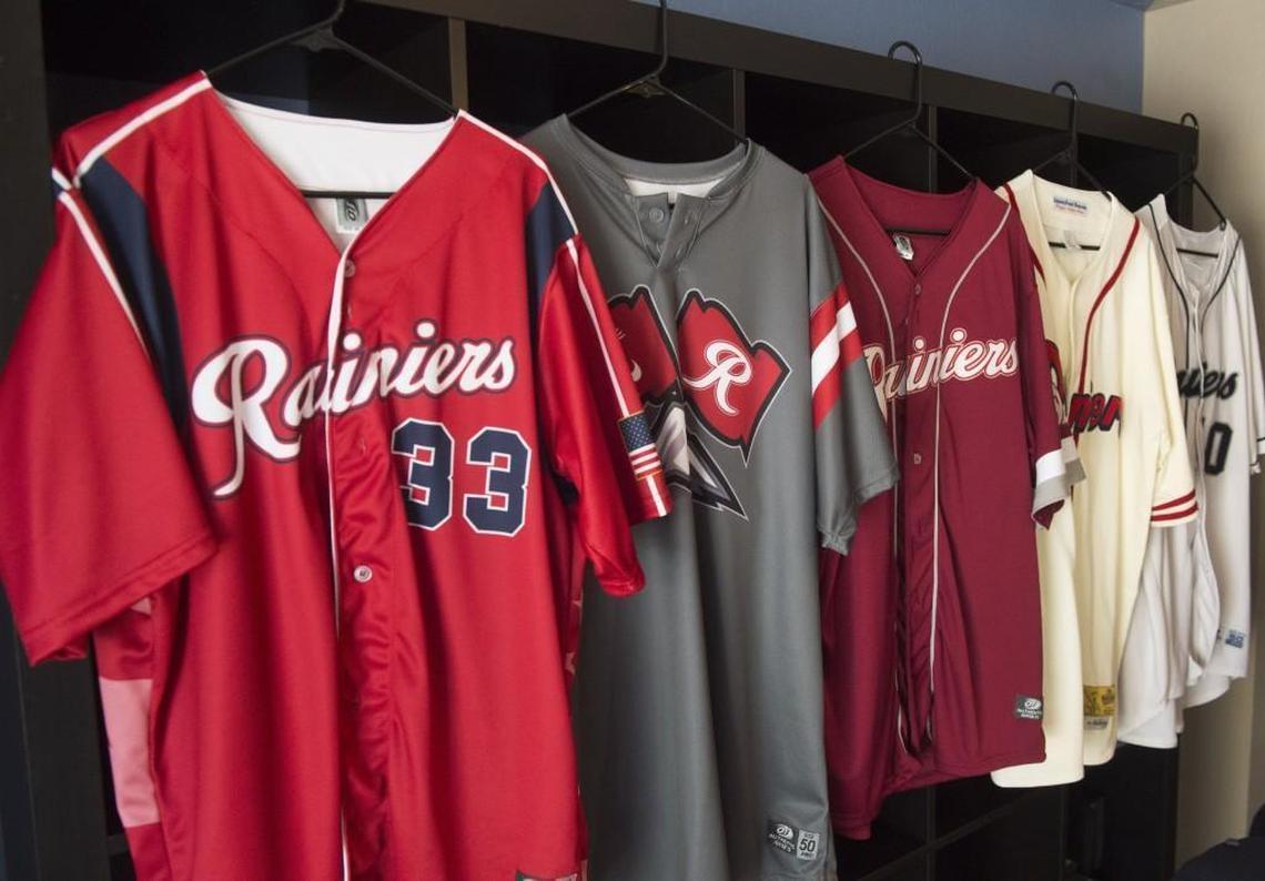 Besides a collection of about 50 Tacoma Rainiers hats, Bret Woody also has a number of jerseys and other sports memorabilia.