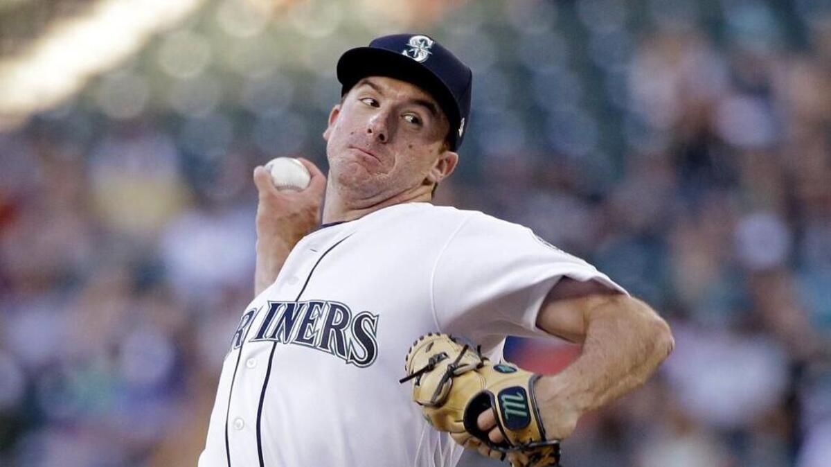 Pitcher Andrew Moore won his major-league debut against the Detroit Tigers but was optioned by the Mariners back to Tacoma the next day.