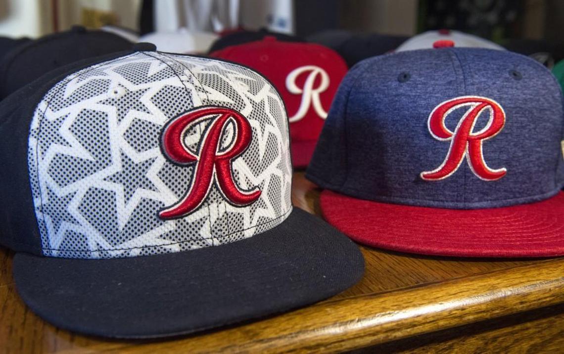Limited edition Fourth of July ball caps are among Bret Woody’s collection. At left is the 2016 version and this year’s cap is at right.