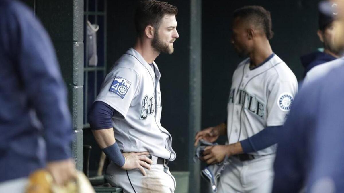 Mitch Haniger sits on the bench after being pulled for a pinch runner in Detroit on April 25. He hasn’t played in the majors since then, but did get into his second rehab game with the Rainiers on Wednesday.
