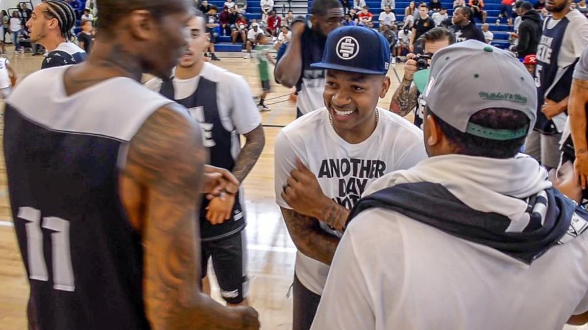 Tacoma’s NBA star Isaiah Thomas jokes around with Team Zeke at his “Zeke-End” basketball tournament tipped off Friday at Tacoma Community College.