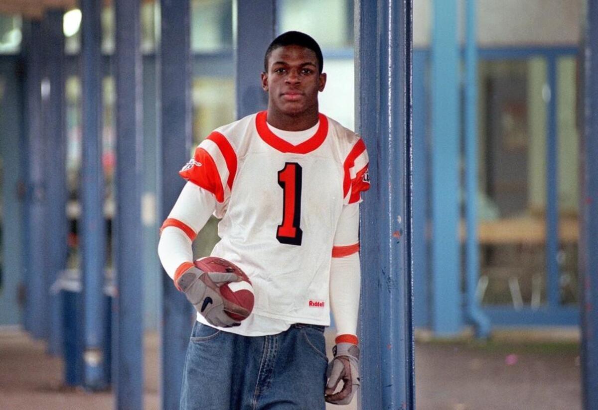 Lakes wide receiver Reggie Williams poses in 2000 at the Lakewood school.