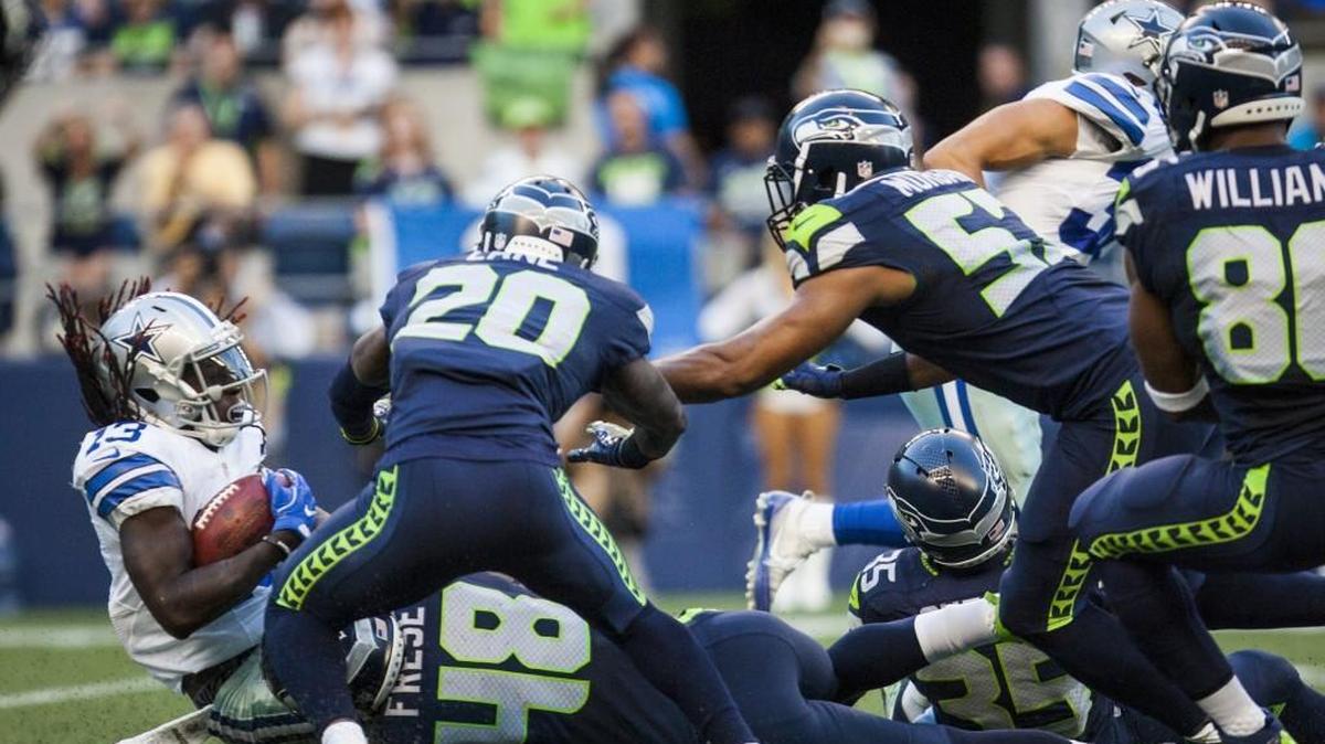 Seattle Seahawks coverage unit stops Dallas Cowboys wide receiver Lucky Whitehead during a punt return in the second quarter of a preseason game at CenturyLink Field Aug. 25.