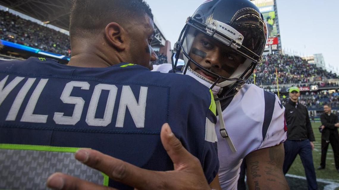Seahawks quarterback Russell Wilson and Texans quarterback Deshaun Watson meet on the field after the game. The Seattle Seahawks played the Houston Texans in a NFL football game at CenturyLink Field in Seattle, Wash., on Sunday, Oct. 29, 2017.