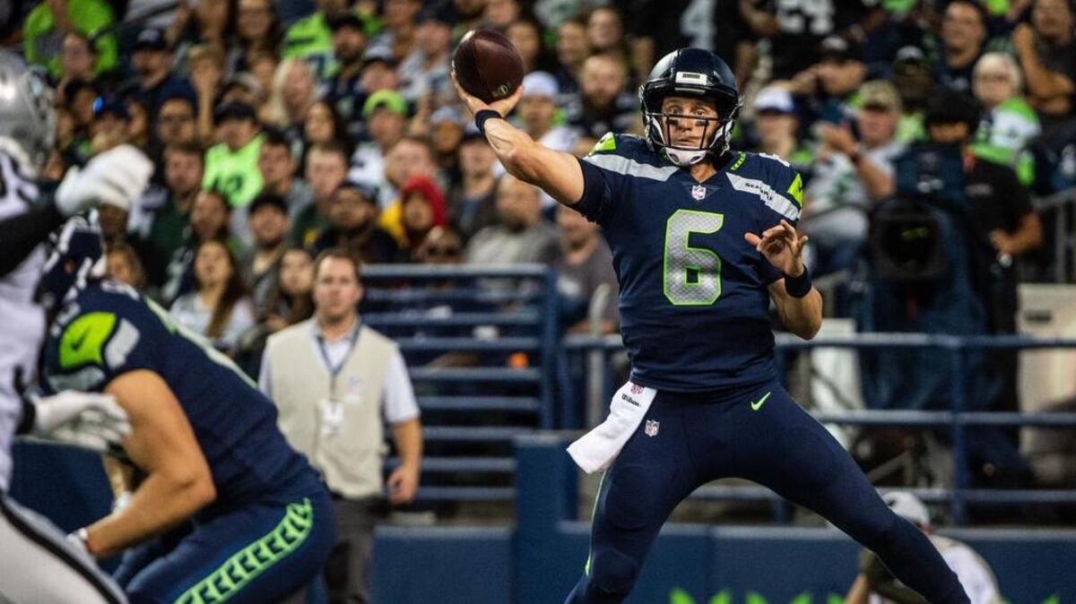 Then-Seahawks backup quarterback Austin Davis (6) throws a pass under pressure in the second quarter of the 2018 preseason finale against the Oakland Raiders at CenturyLink Field in Seattle. On Friday the Seahawks announced Davis is starting a coaching career as an assistant quarterbacks coach with the team for 2019, two years after he backed up Seattle quarterback Russell Wilson.