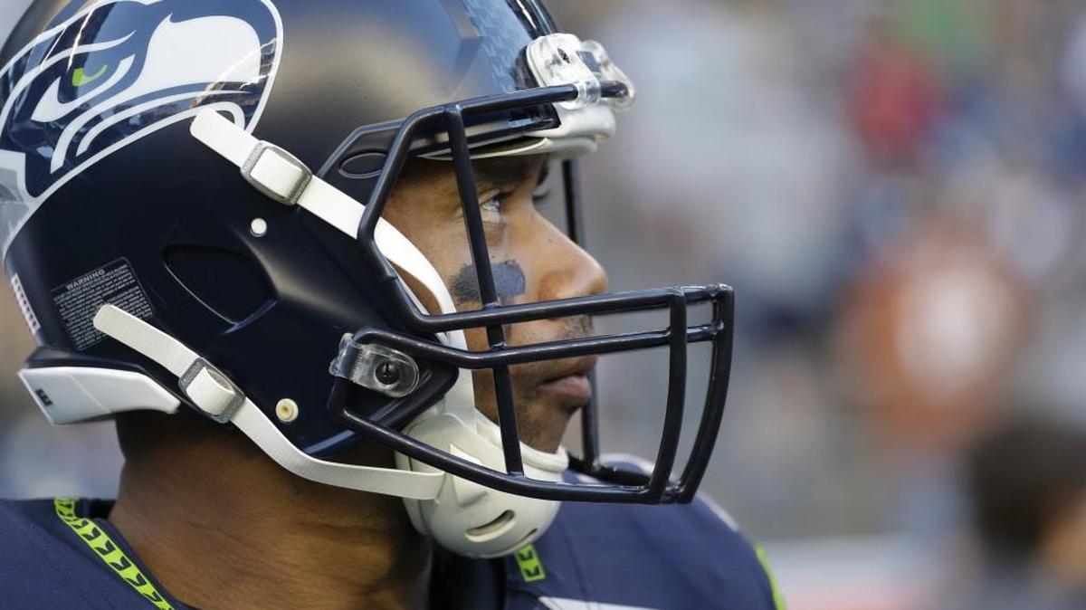 Seattle Seahawks quarterback Russell Wilson stands on the field during a preseason NFL football game against the Dallas Cowboys, Thursday, Aug. 25, 2016, in Seattle.