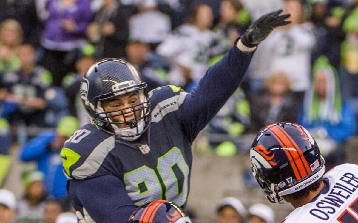
Seahawks defensive lineman Jesse Williams attempts to block a pass in the second quarter of an NFL preseason football game between Seattle and Denver at Century Link Field in Seattle, August 14, 2015.
