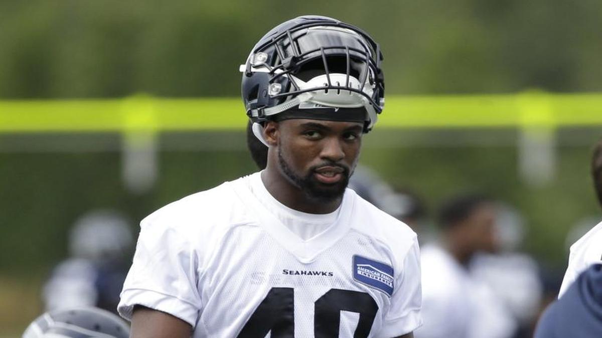 Seattle Seahawks' Tyvis Powell walks on the field during the team's NFL football training camp Saturday, July 30, 2016, in Renton.