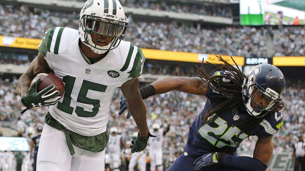 Six-time Pro Bowl wide receiver Brandon Marshall (15), here playing against former Seahawks cornerback Richard Sherman in a 2016 game, officially signed with Seattle on Wednesday.