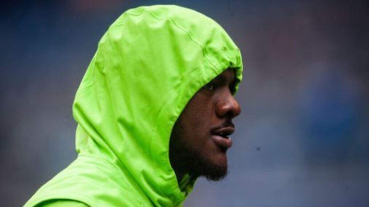 Frank Clark during early pregame warmups in a light rain Sunday at CenturyLink Field. Despite being sick all week the Seahawks’ leading pass rusher was active to play against the Los Angeles Rams.