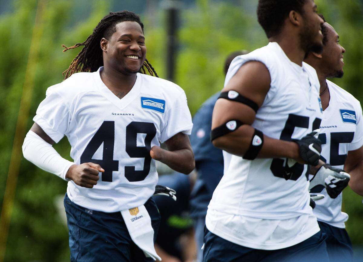 Linebacker Shaquem Griffin (49) smiles in warm-up drills at Seahawks rookie minicamp at the Virginia Mason Athletic Center in Renton last week.