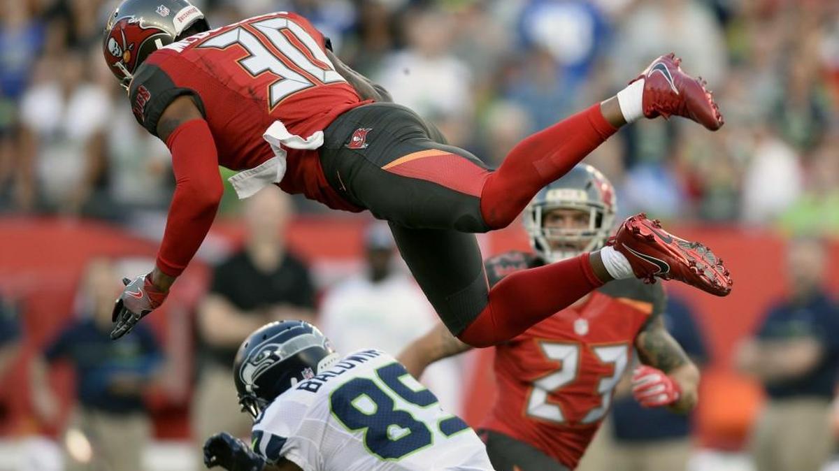 Seattle’s new signing Bradley McDougald (30), shown breaking up a pass to Doug Baldwin, has played at both safety positions, and he has the size that Seahawks coach Pete Carroll likes at cornerback.