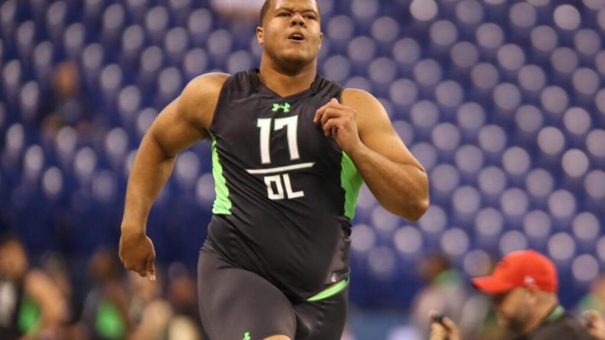 Stanford offensive lineman and Puyallup High school grad Joshua Garnett runs a drill at the NFL football scouting combine in February in Indianapolis.