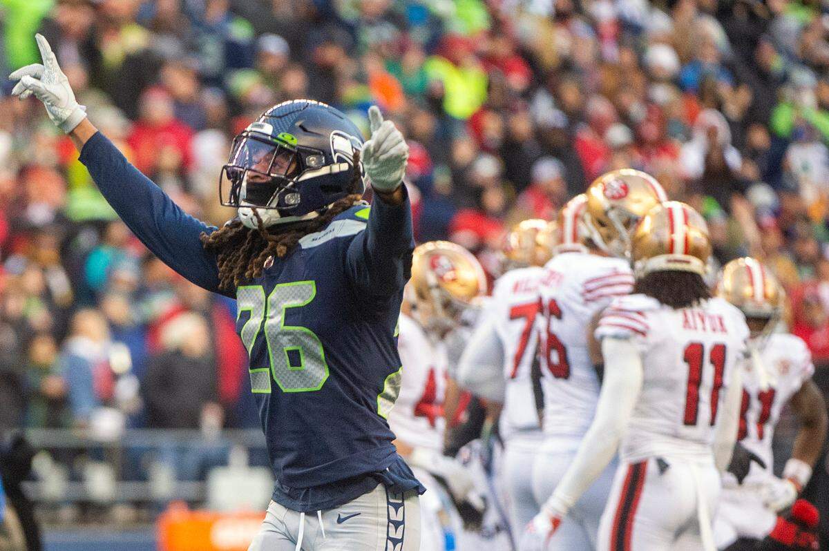 Seattle defensive back Ryan Neal (26) celebrates after the Seahawks defense recovered a San Francisco 49ers fumble in the third quarter of an NFL game on Sunday at Lumen Field in Seattle. Referees determined the Seahawks did not recover the fumble but the play forced a fourth down for the 49ers.