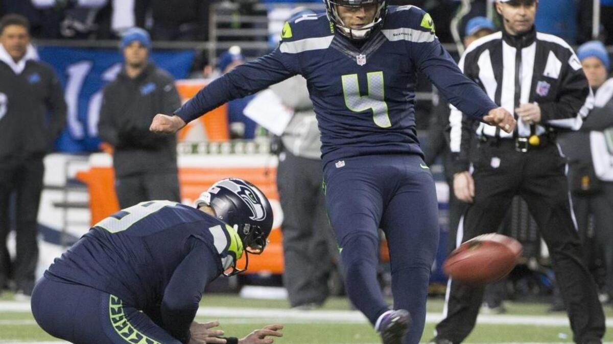 Seahawks kicker Steven Hauschka makes a field goal as punter Jon Ryan holds in Seattle’s 26-6 victory over Detroit in the wild card round of the playoffs. Hauschka made both of his field goal attempts but missed an extra point.