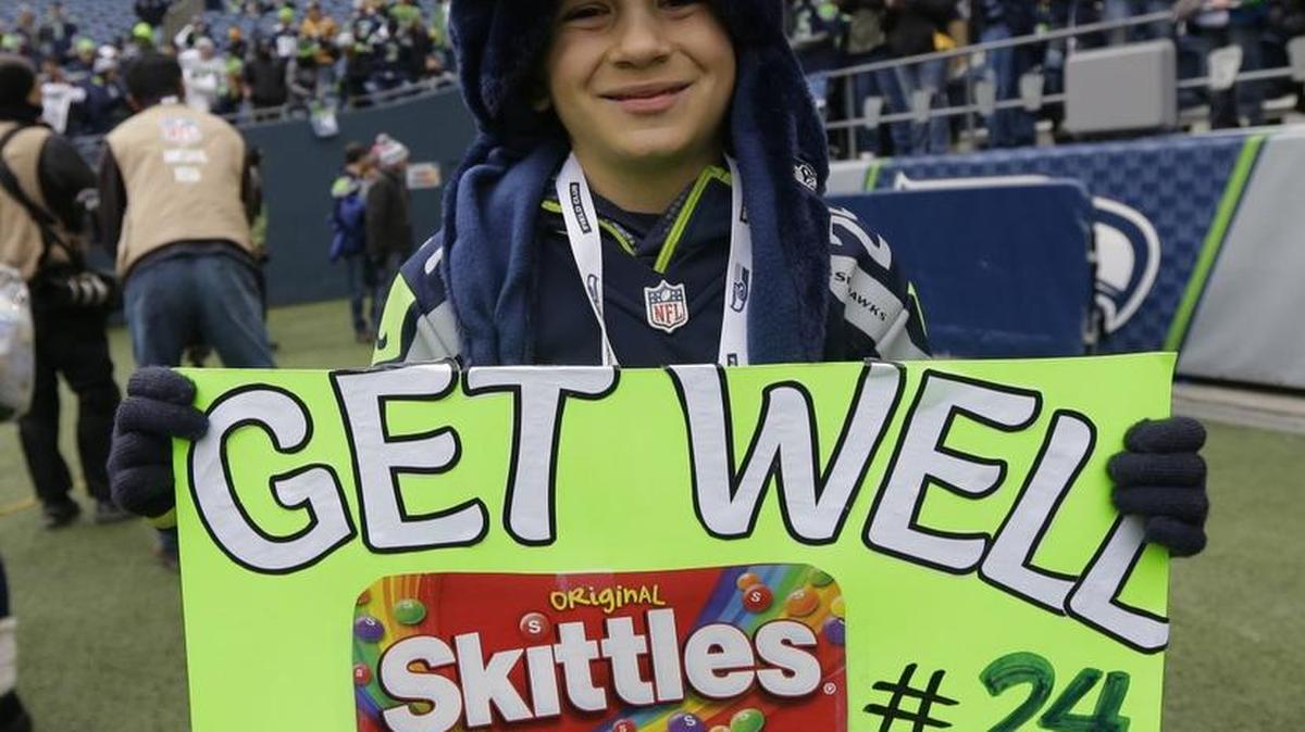 A young Seahawks fans holds up a sign wishing well injured Seahawks' running back Marshawn Lynch before a game against the Steelers on Nov. 29.