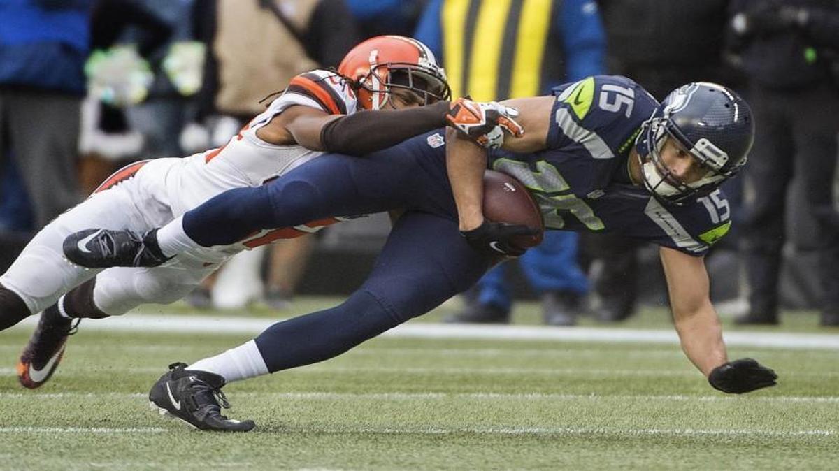 Seahawks receiver Jermaine Kearse is brought down after making a catch against Cleveland. Photo taken in Seattle on Sunday, Dec. 20, 2015.