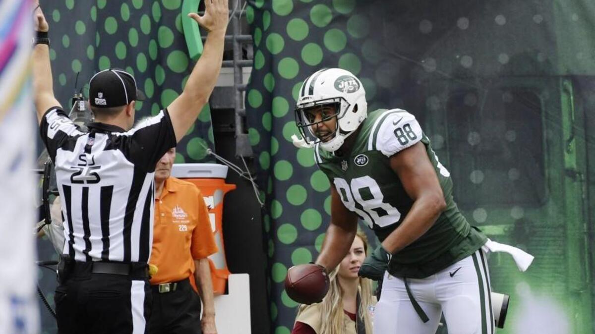 New York Jets tight end Austin Seferian-Jenkins (88) celebrates after catching a pass for a touchdown against the New England Patriots on Oct. 15. The former Gig Harbor High and Washington standout is having a breakout season.