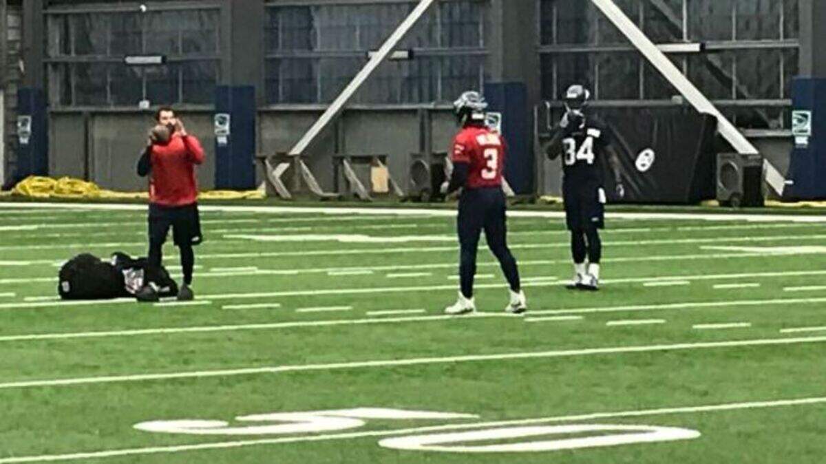 Quarterback Russell Wilson and tight end Ed Dickson spend extra time again working together throwing and catching after practice this week at Seahawks headquarters in Renton. Offensive coordinator Brian Schottenheimer, a veteran of 19 seasons as an NFL coach, says “I’ve been around some pretty good quarterbacks, I’ve never been around a guy that’s put that much work and preparation into it.”