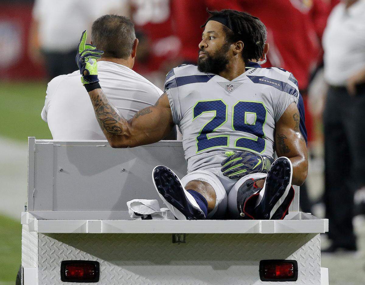 Seattle Seahawks defensive back Earl Thomas (29) gestures to his bench as he leaves the field after breaking his leg against the Arizona Cardinals during the second half of an NFL football game, Sunday, Sept. 30, 2018, in Glendale, Ariz. The Seahawks won 20-17.