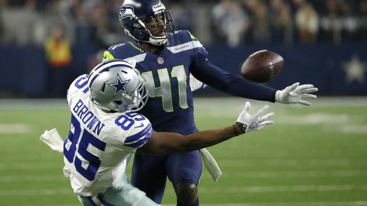 Seahawks cornerback Byron Maxwell breaks up a pass intended for Dallas Cowboys' Noah Brown on Christmas Eve in Arlington, Texas. . Seattle is trying to re-sign Maxwell for 2018. The team still needs cornerbacks after C.J. Smith failed his trade physical and went back to Cleveland.