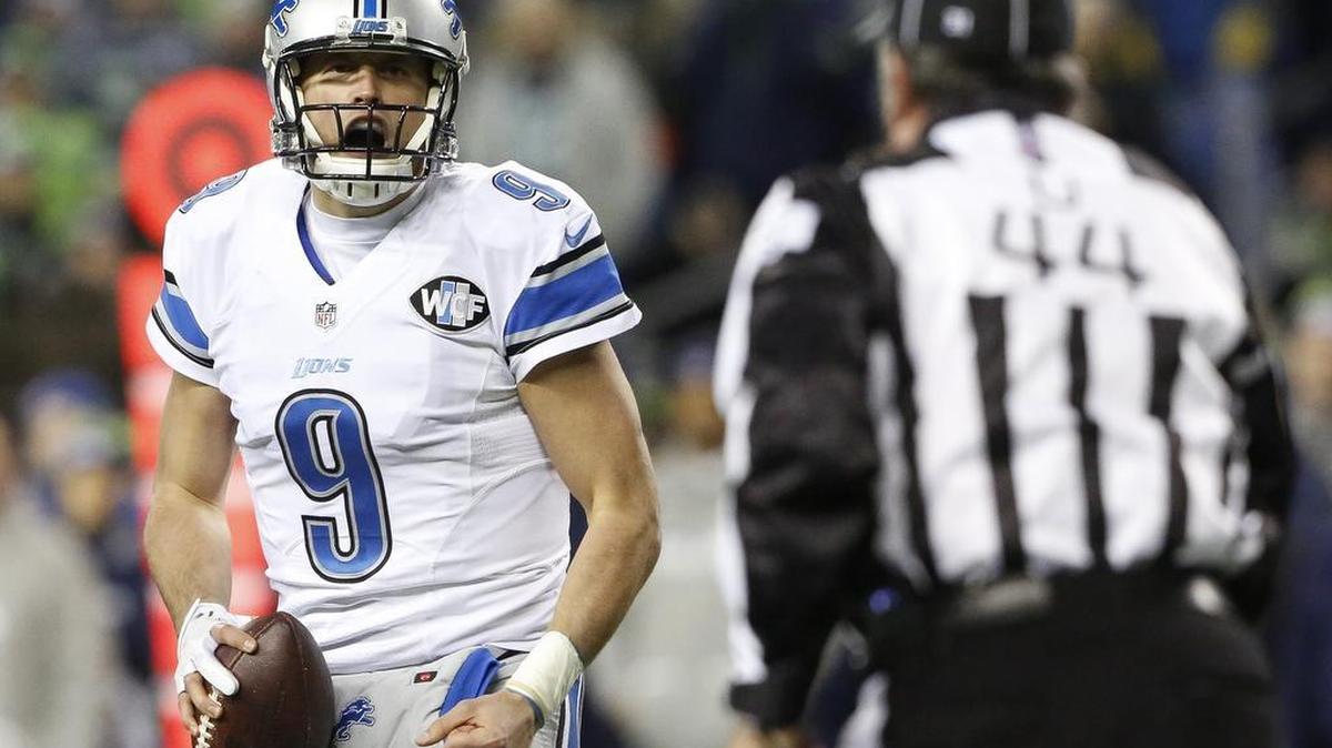 Lions quarterback Matthew Stafford (9) argues a penalty call with an official in the second quarter. The Seattle Seahawks played the Detroit Lions in a NFL Wildcard game at CenturyLink Field in Seattle, Wash., on Saturday, January 7, 2017.