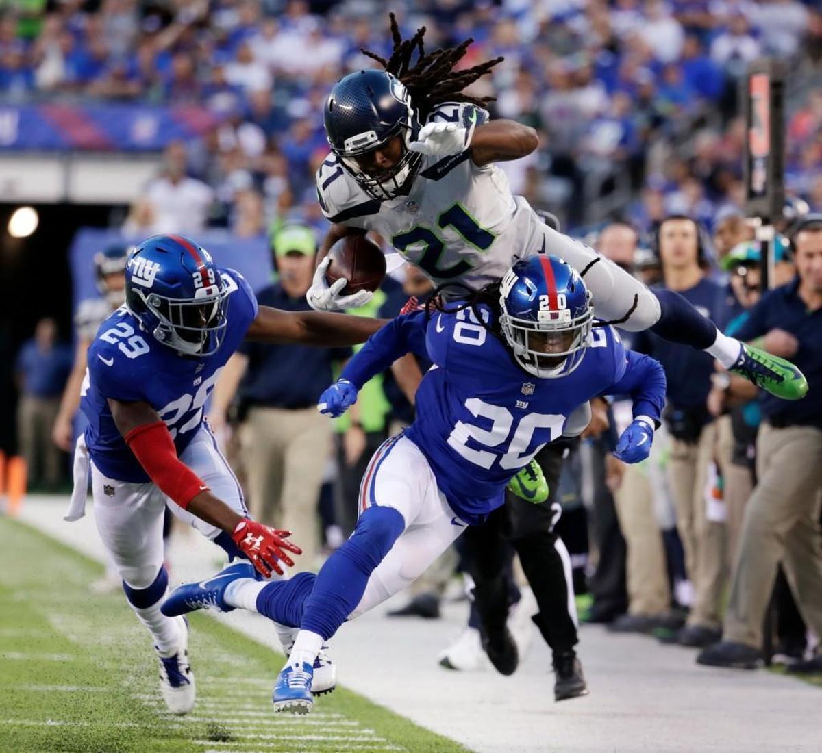 Seattle Seahawks J.D. McKissic jumps over New York Giants’ Janoris Jenkins (20) on Sunday during the first half in East Rutherford, N.J.