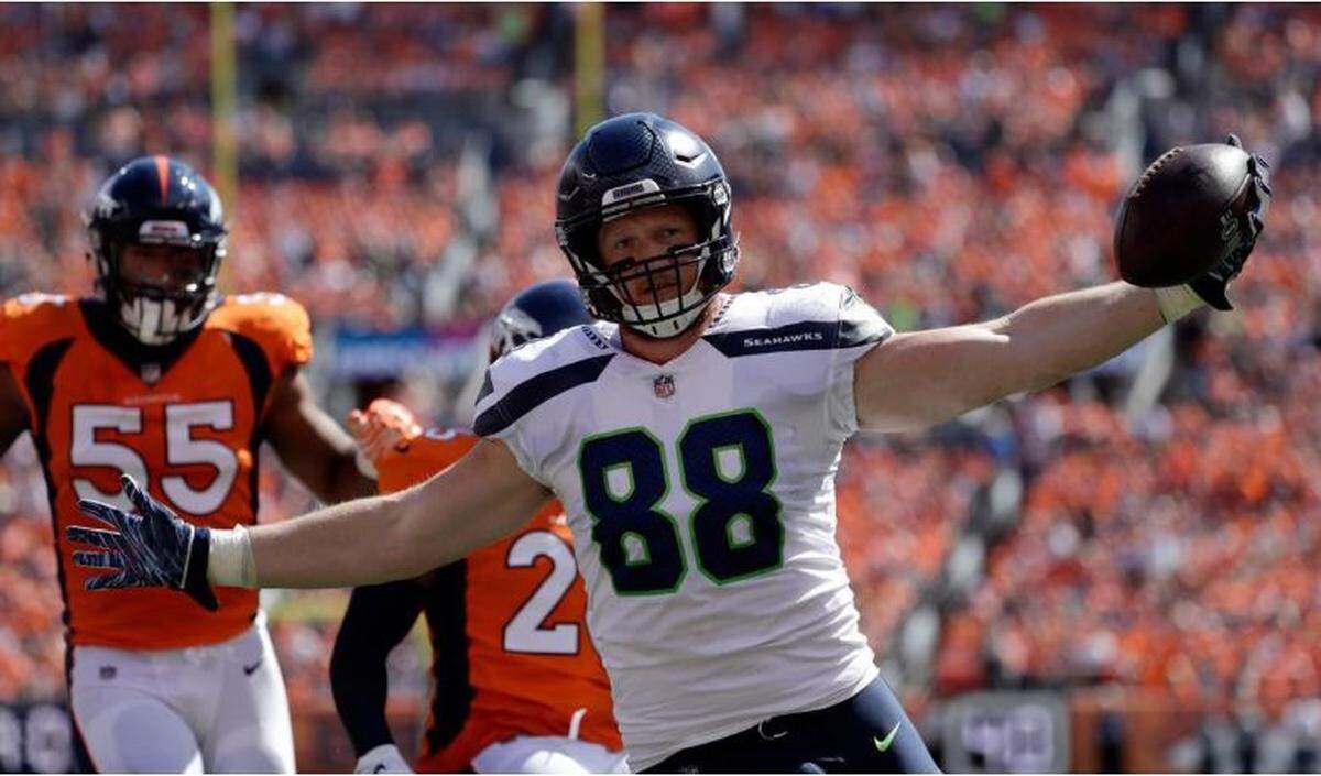 Seahawks 2018 rookie Will Dissly from the University of Washington scores his first NFL touchdown in last season’s opening game at Denver. The former UW defensive lineman, the first tight end to have 100 yards receiving with a touchdown catch in his first NFL game, is recovering well from a season-ending knee injury and surgery, coach Pete Carroll said Tuesday at the league’s annual meetings in Phoenix.