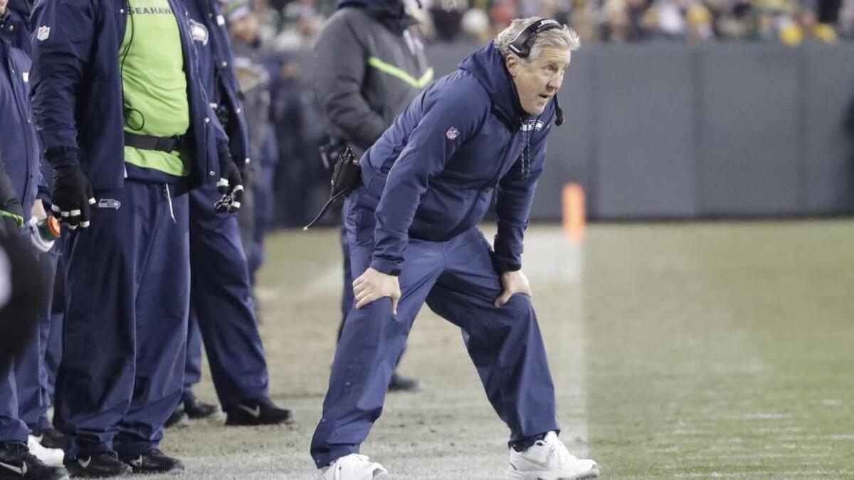 Seahawks coach Pete Carroll watches his team against Green Bay on Sunday. “What a mess. We looked like garbage out there,” Carroll said.